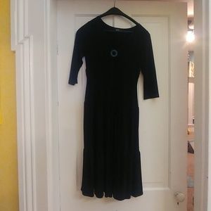 Black midi jersey dress with removal medallion.